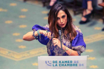 Belgian Foreign Minister Hadja Lahbib chops her hair out in parliament