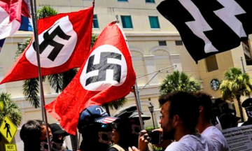 White supremacists march in Florida with Swastika flags and Hitler Salutes