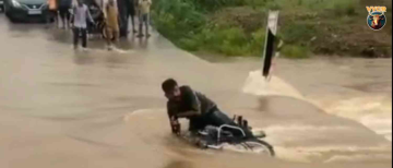 Shocking Video: Bike Rider Swept Away in Flooded Jhareti Drain in Sawai Madhopur, Rajasthan
