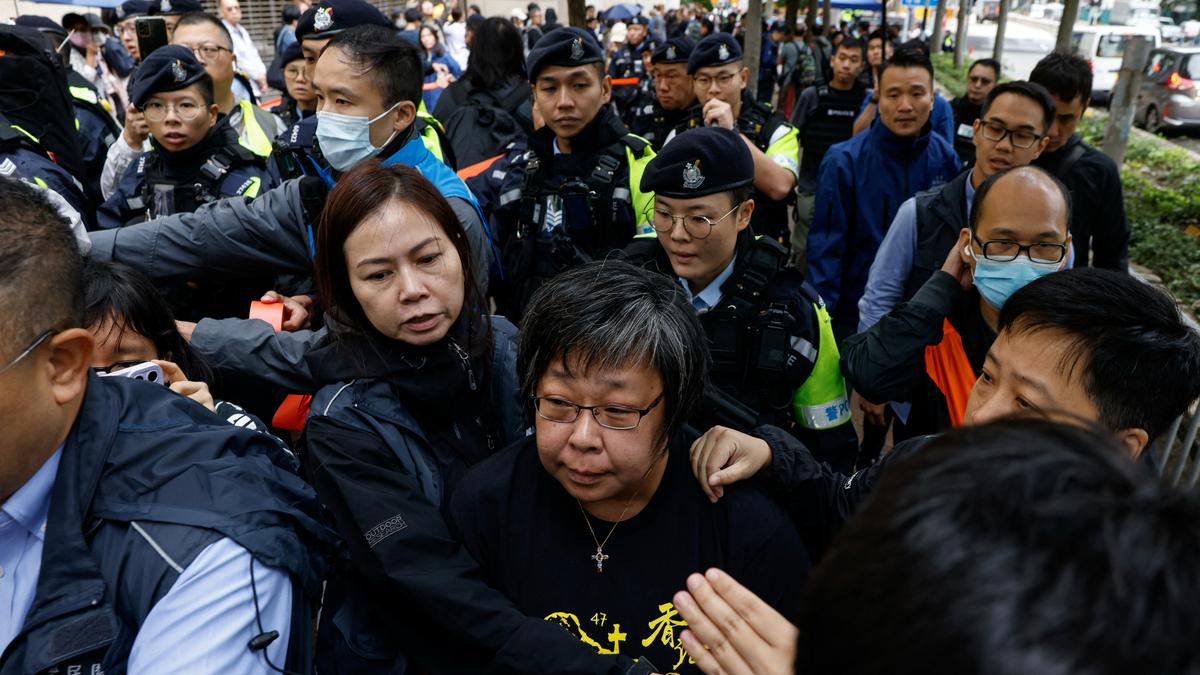 Police stand guard outside the West Kowloon Magistrates' Courts building, before the sentencing against the 45 convicted pro-democracy activists charged under the national security law, in Hong Kong, China November 19, 2024. 