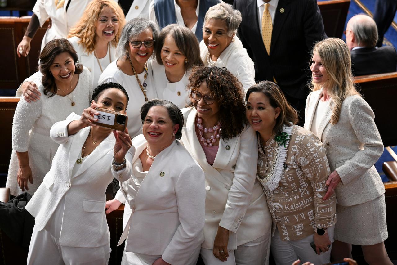 Female representatives gathered in the House of Representatives were notably wearing white