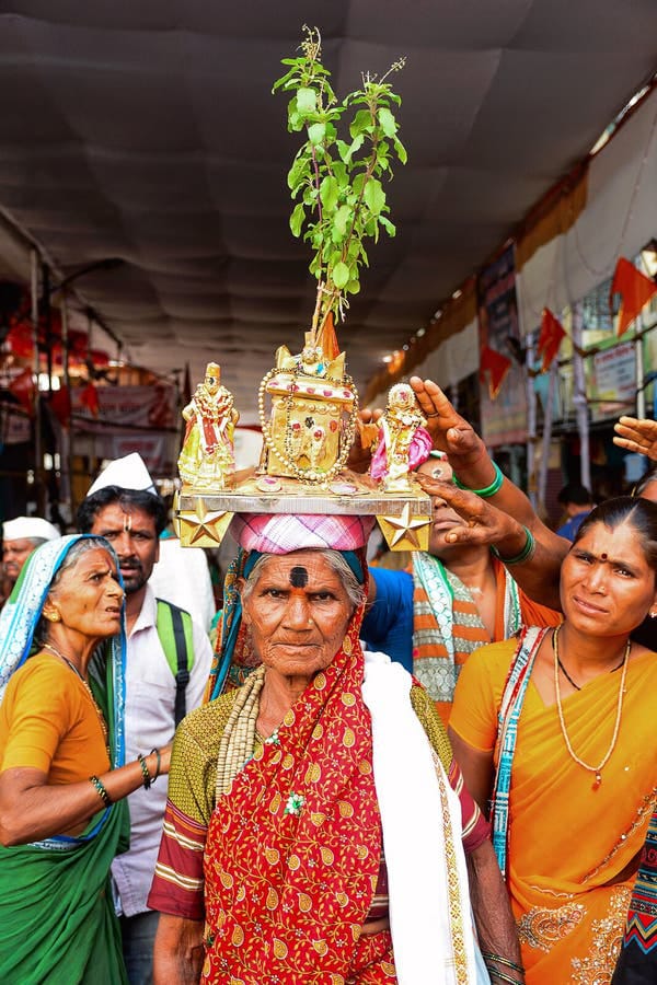 carrying Tulsi 