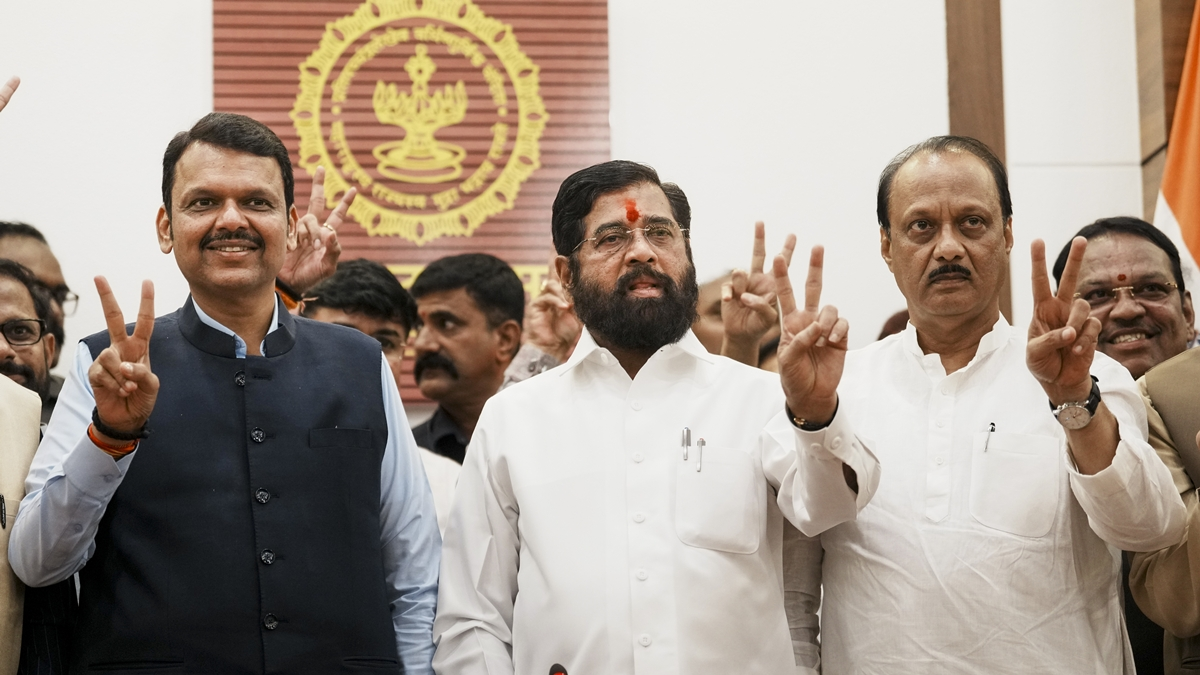 Chief Minister Eknath Shinde with Deputy Chief Ministers Devendra Fadnavis and Ajit Pawar flashes victory sign during a press conference as the BJP-led Mahayuti alliance secures victory amid the counting of votes for the Maharashtra.