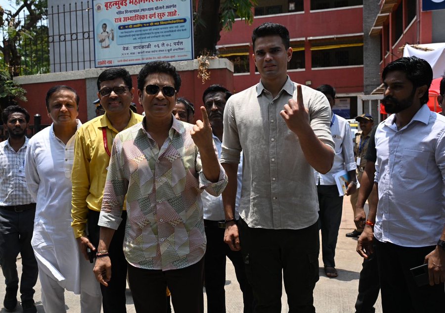 photo: Sachin Tendulkar votes with son