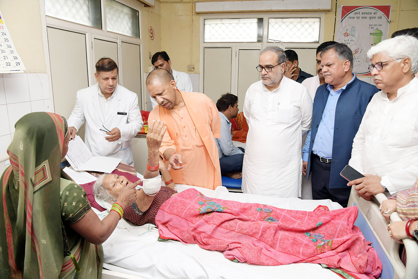 photo: yogi at hathras meeting patients 