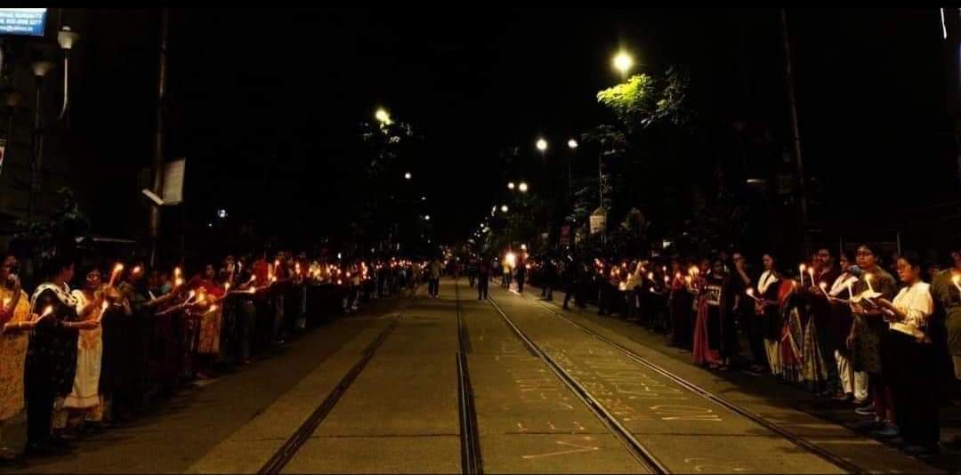 People hold candles during a demonstration on September 4, 2024, to condemn the rape and murder of a doctor at the RG Kar Medical College and Hospital in Kolkata