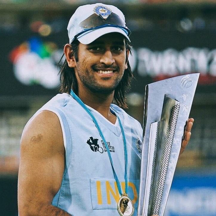 Dhoni holding world cup 