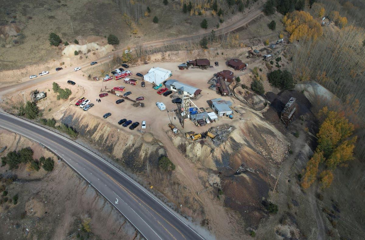 A police officer moves a barrier for an emergency vehicle Thursday, October 9, 2024, at Mollie Kathleen Gold Mine in Cripple Creek, Colorado.