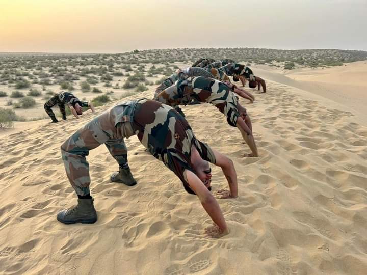 indian army officers performing yoga