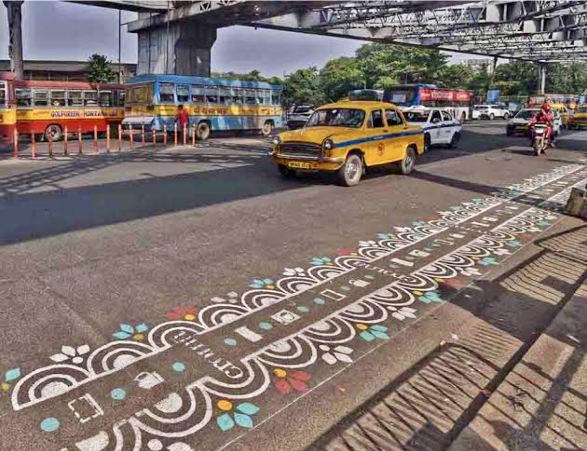 Colorful 'Alpana' patterns decorate Kolkata's Howrah Bridge before Durga Puja