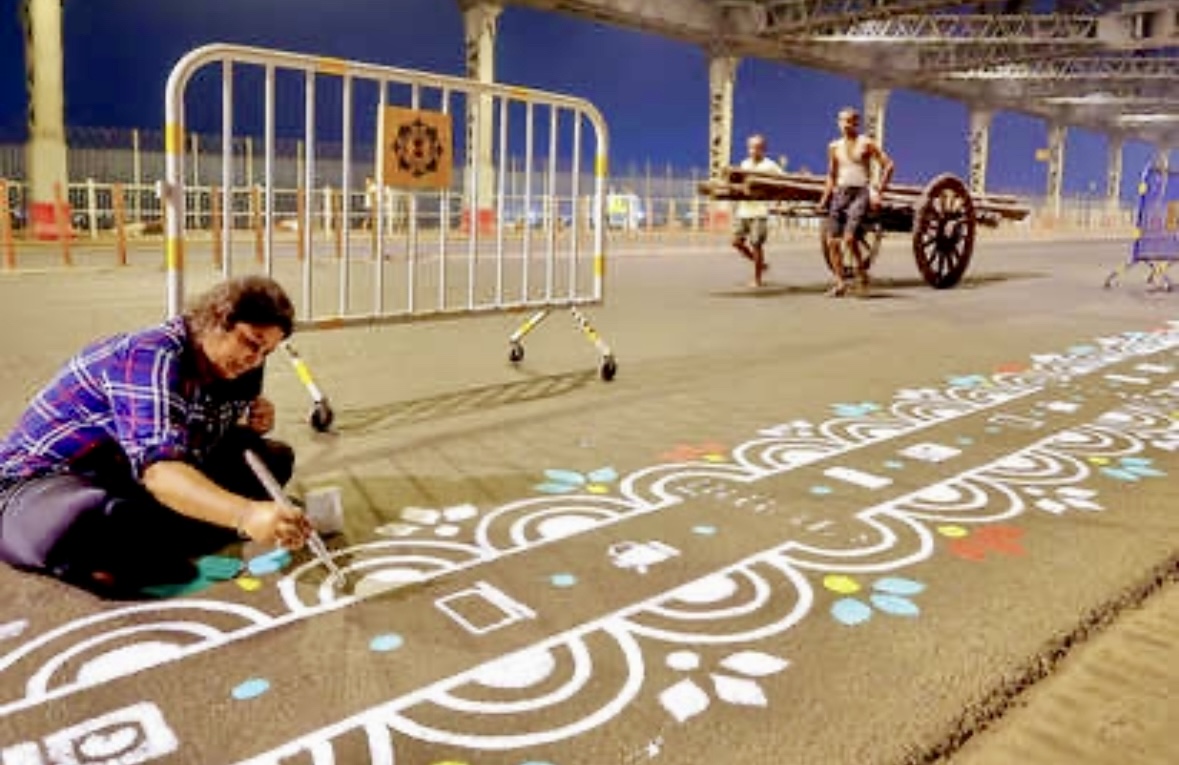 Colorful 'Alpana' patterns decorate Kolkata's Howrah Bridge before Durga Puja