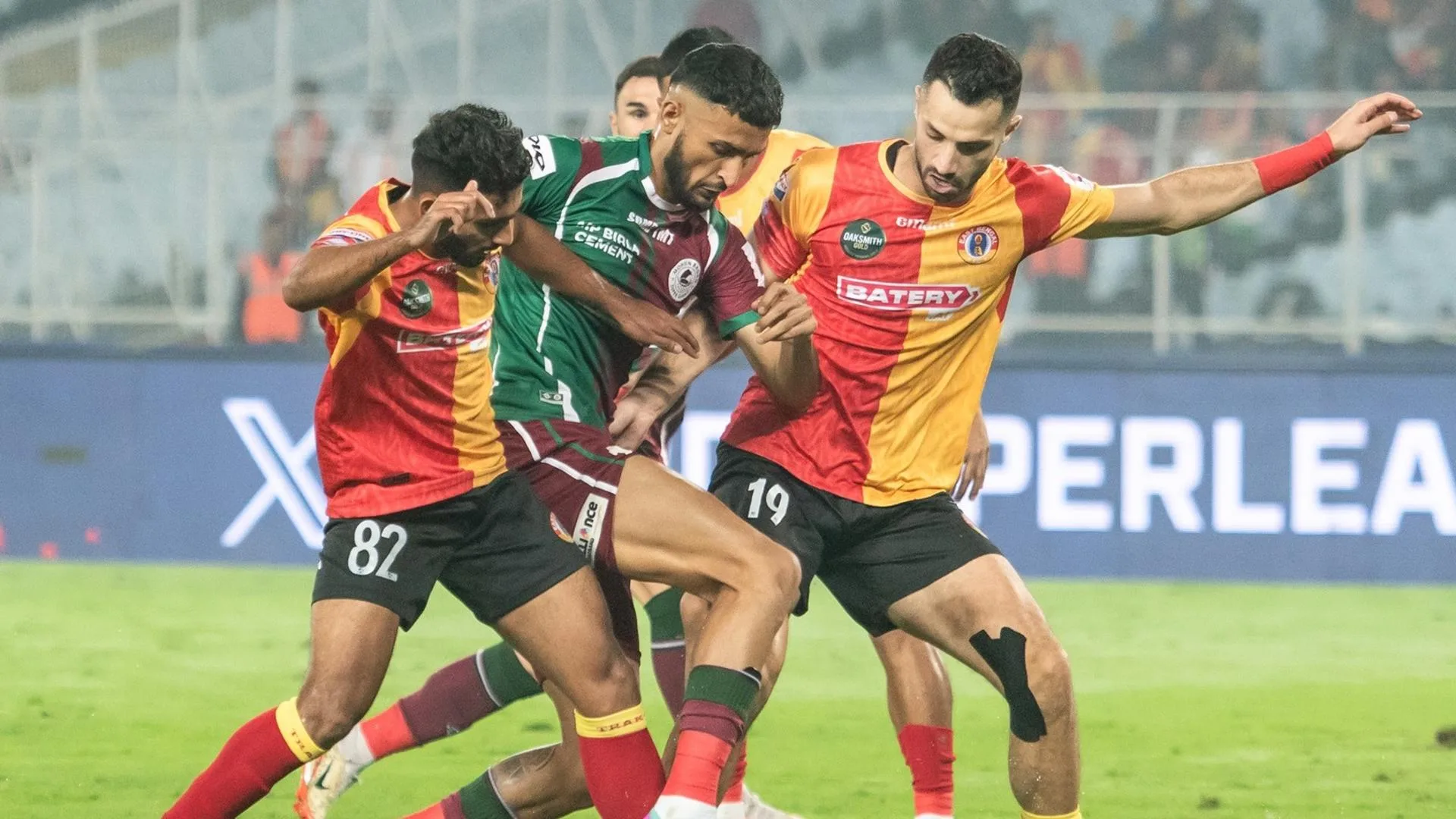 Mohun Bagan Super Giant and East Bengal FC players vie for the ball during a Durand Cup football match, at Vivekananda Yuba Bharati Krirangan in Kolkata. | Photo Credit