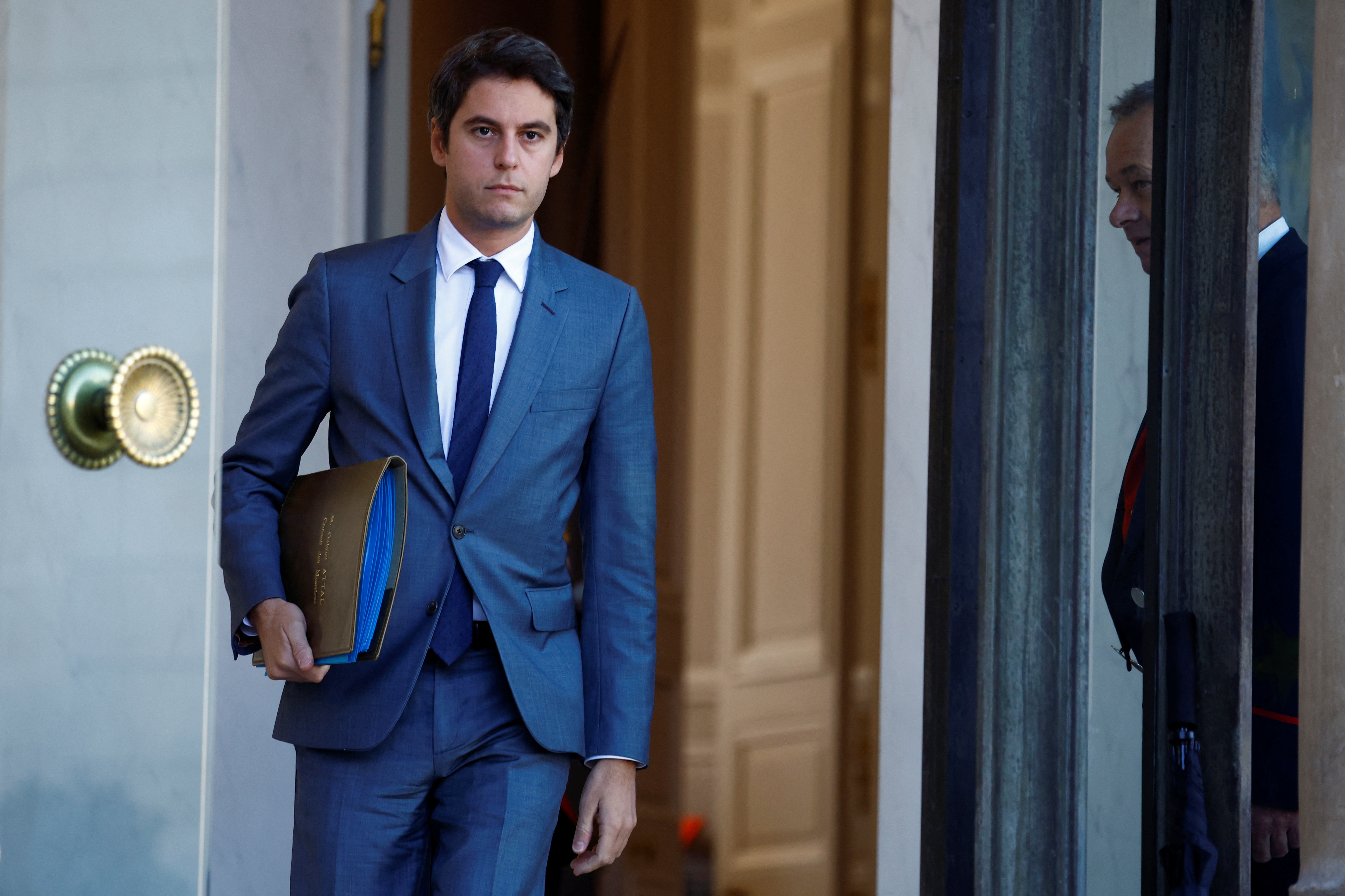 Gabriel Attal, 34, becomes France's youngest, first gay PM