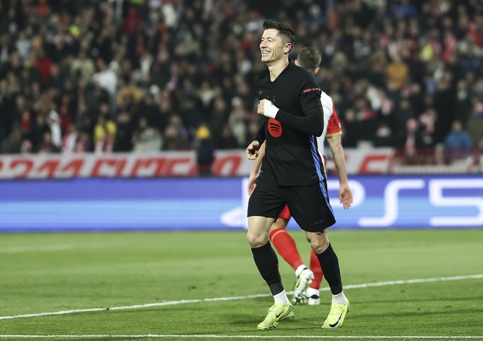 Lewandowski 9 celebrating after scoring a goal.