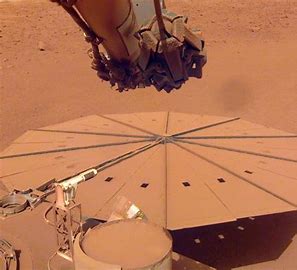 The team even used the lander's robotic arm to help clear dust from the solar panels