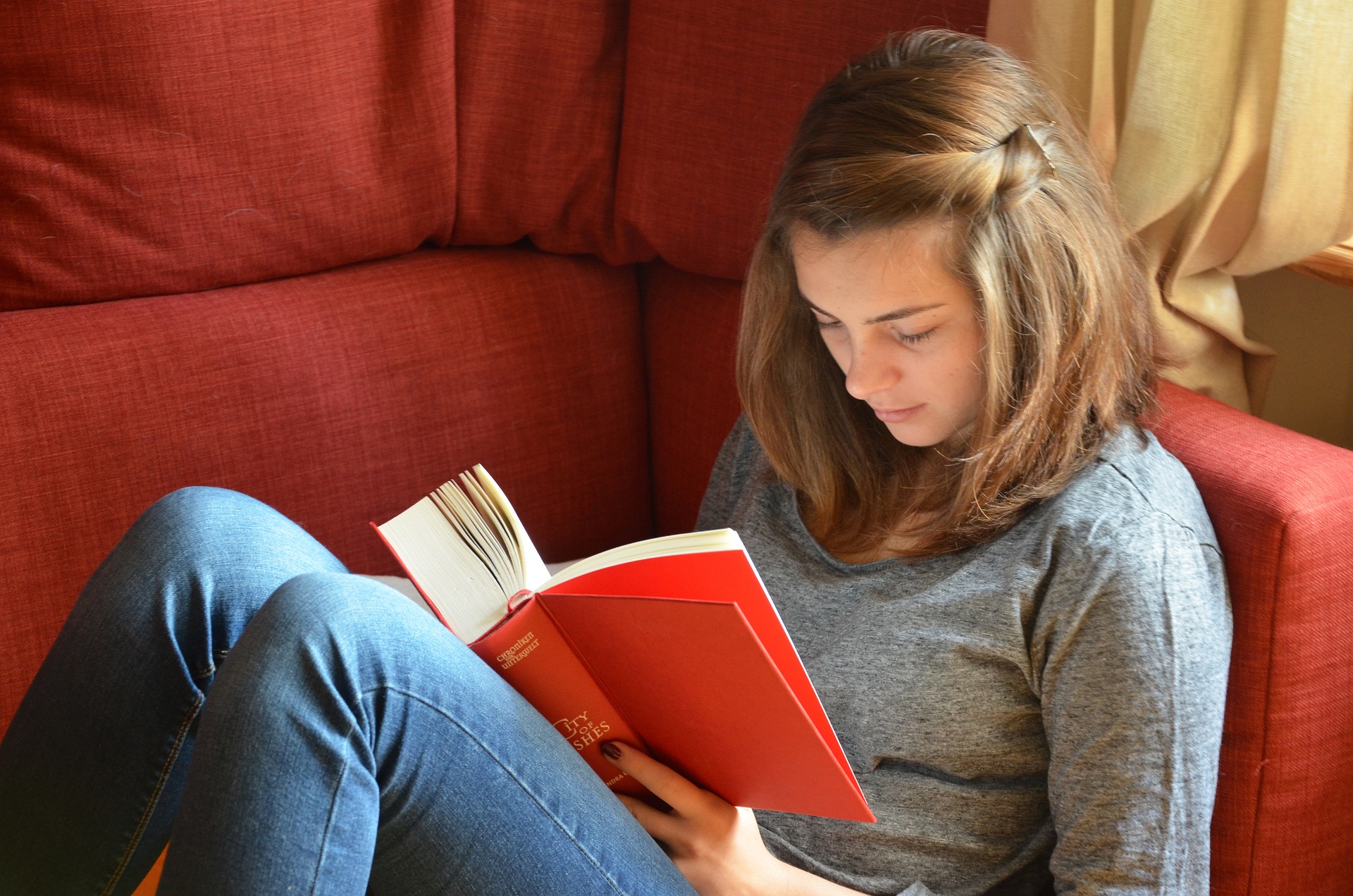 Photo: A child reading a book